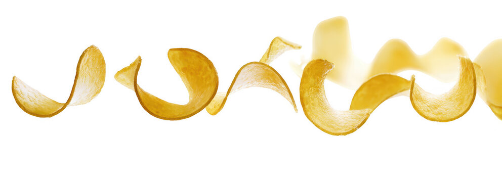 Golden crispy potato chips in wavy horizontal line on white background for snack food advertising
