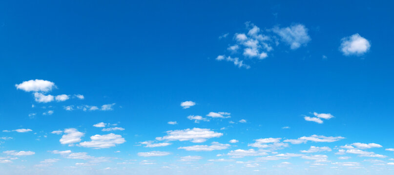 Panoramic fluffy cloud in the blue sky. Sky with cloud on a sunny day.