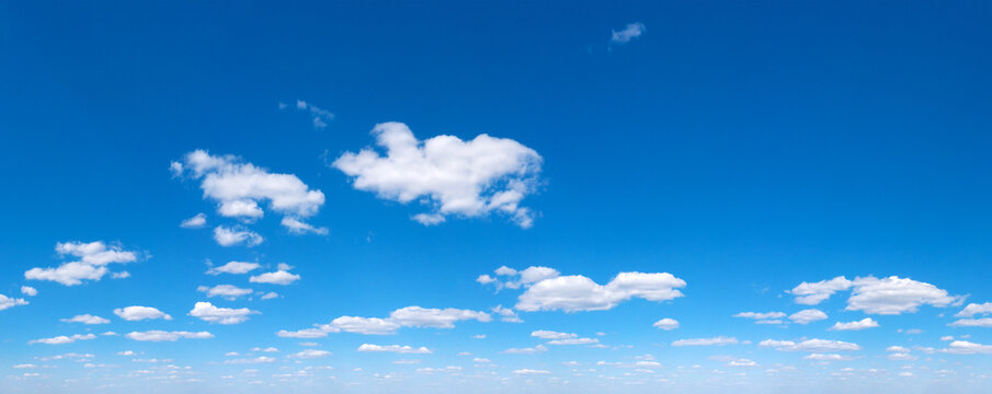 Blue Sky background with tiny Clouds. Panorama background