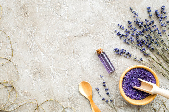 Essential oil and lavender salt with flowers top view