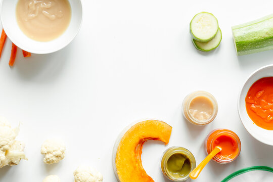 cooking vegetable puree for baby on white background top view