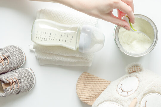 preparation of mixture baby feeding on white background top view