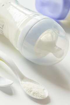 preparation of mixture baby feeding on white background