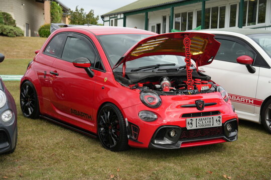 A stunning red modified Abarth 595 Trofeo on display at a car show. Harrogate, Yorkshire, England, UK. August 2026. 