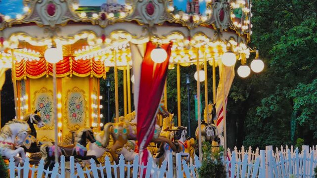 Twilight atmosphere at a retro carousel&nbsp;&mdash;&nbsp;whimsical lights and wooden horse figures.