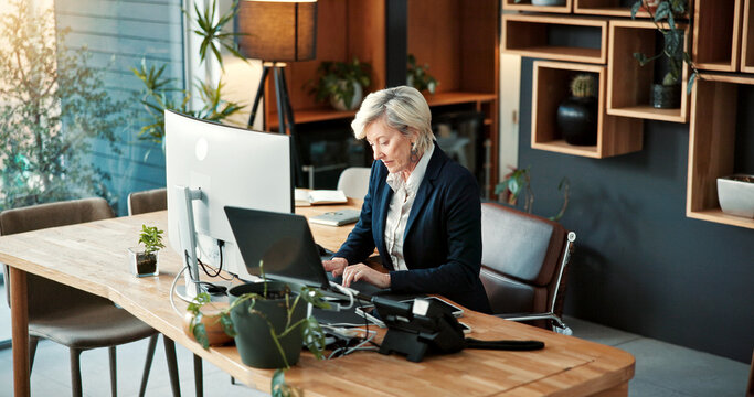 Business, woman and typing in office with computer, research and online evidence for court case. Mature person, lawyer and email in workplace with pc, witness testimony and investigation for justice