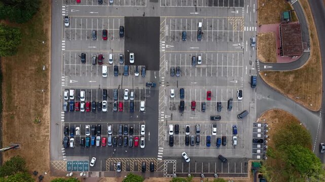 Aerial view of Welcome Break Corley Northbound Services M6 parking lot with rows of parked cars in Coventry, England, United Kingdom.