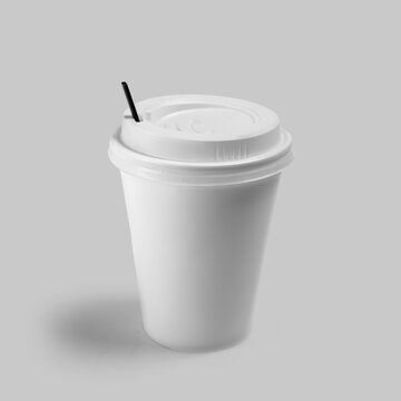 Blank white paper coffee cup with lid and black stirrer on light gray background. Ideal mockup template. Mockup or Copyspace