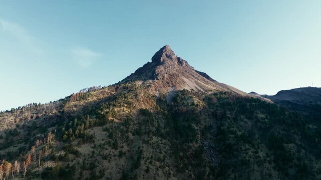 Nevado de Colima (Zapotepetl) volcanic summit rising above rugged forested slopes in Nevado de Colima National Park, Jalisco, Mexico. Panoramic establishing shot.