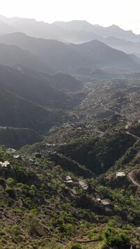 Breathtaking aerial view revealing a stunning mountainous landscape with scattered villages and winding roads nestled in the valleys and hillsides of rural taiz. Yemen. In yemen
