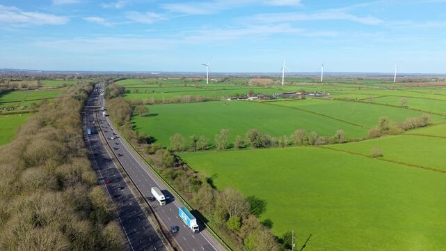 Elevated Drone View of Fast-Moving Traffic on M1 Motorway in Leicestershire