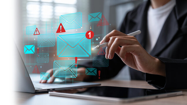 Businesswoman using laptop while email notification.