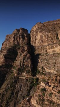 Dramatic aerial view flying over a steep and arid mountain range. In taiz yemen