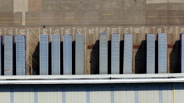 High-Angle Perspective of Freight Trucks Parked at Distribution Centre Docks
