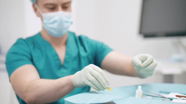 Professional surgeon in a sterile environment preparing medical instruments for a procedure. The doctor, wearing scrubs and gloves, carefully handles an IV catheter