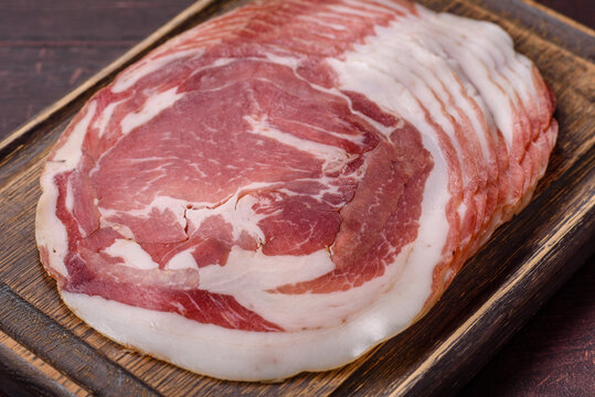 Slices of pork pancetta, ham, or bacon for a festive antipasto platter