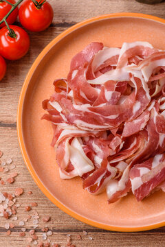 Slices of pork pancetta, ham, or bacon for a festive antipasto platter