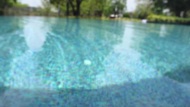 Abstract blur outdoor swimming pool in tropical resort hotel summer background