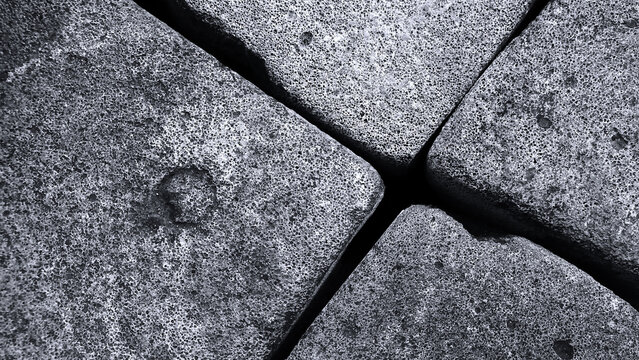 Interlocking concrete paving blocks in a monochromatic color.