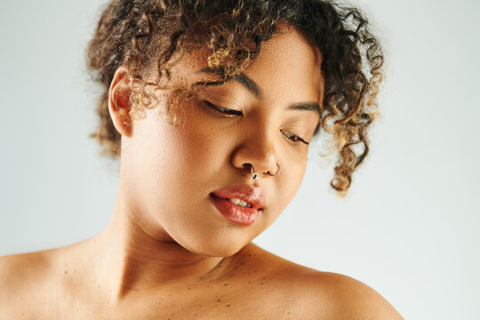 Confident young woman radiates elegance with natural beauty and chic style