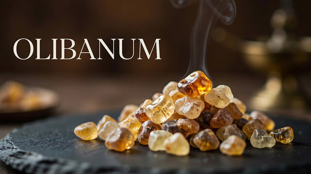 A pile of aromatic frankincense resin burning with a thin wisp of fragrant smoke on a dark stone surface