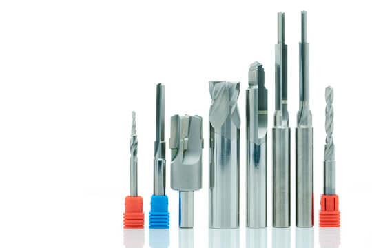 Made to order special carbide cutting tools, coated step drill and reamer set isolated on white background for industrial machining, precision engineering, metalworking and manufacturing use.