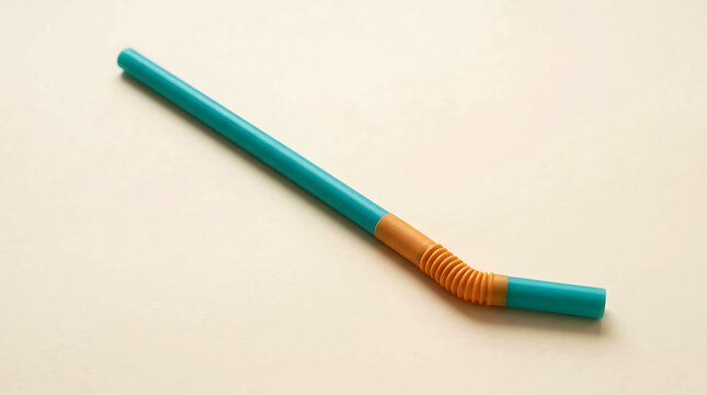 A single turquoise and orange bendable plastic drinking straw on a clean background