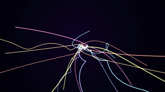 Abstract digital motion graphics showing colorful light trails moving in dark space creating complex geometric patterns for modern visual projection art projects.