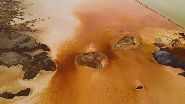 Aerial view of the vibrant and colorful mineral deposits and salt formations in the Dalol geothermal area, Dalol, Afar, Ethiopia.