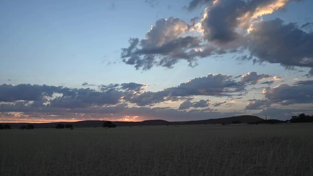 Clouds drift over the Namibian desert, African landscape. Timelapse.