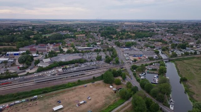 Dolly back aerial shot of Ely with the train station in the foreground