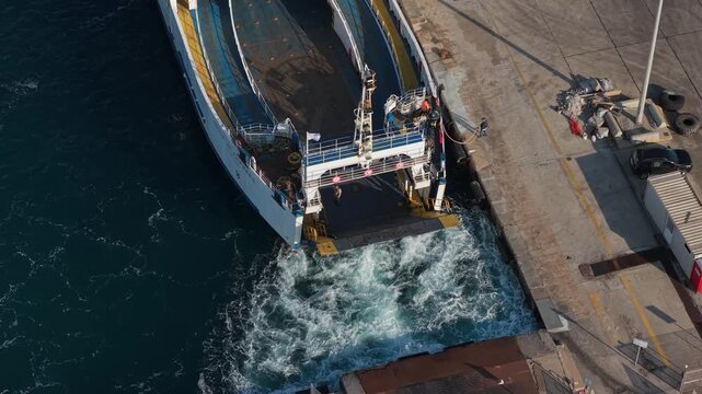A RoRo ferry at the port of Portovesme in Portoscuso, Sardinia, Italy - drone shot