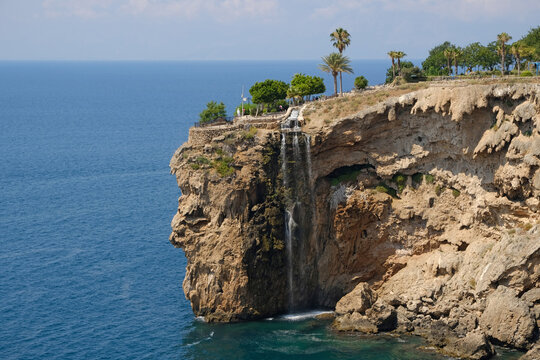 Coastal waterfall at Ziya Gokalp Kent Park on Bababurnu Cape in Fener, Muratpasa, Antalya, Turkey overlooking the Mediterranean Sea.