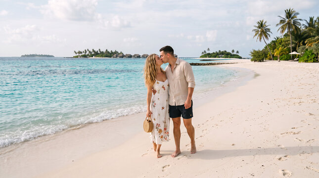Happy couple walking along a stunning Maldives beach on a sunny day, wearing summer vacation outfits including a white swimsuit, Honeymoon, Valentine's Day, Love You