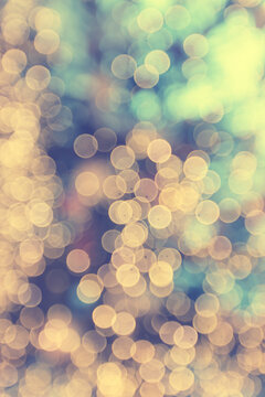 Golden New Year bokeh, abstract background with blurred circles.