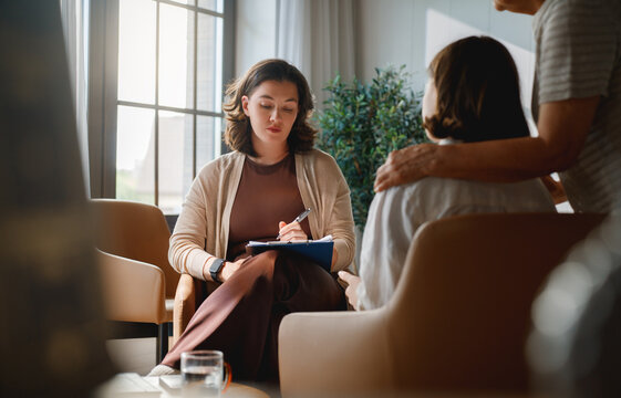 Empathetic Psychologist Supporting Patient During Counseling