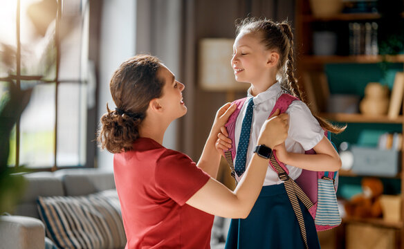 Happy Mother Sending Daughter to School, Morning Routine at Home