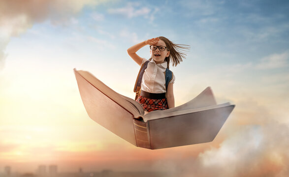 child flying on the book