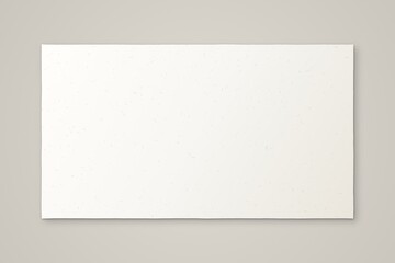 Fototapeta premium A blank rectangular sheet of textured white paper on a neutral gray background