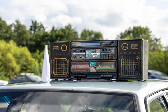 Vintage cassette boombox with radio and speakers on a car roof in Kaliningrad, Russia. August 23, 2026
