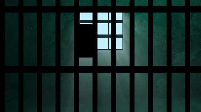 A prison cell with bars and rays of light coming through the window. 4K