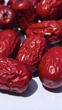 Fresh Chinese jujube (Ziziphus jujuba) fruits with smooth green to reddish-brown skin, commonly consumed fresh or dried and valued as a traditional fruit crop