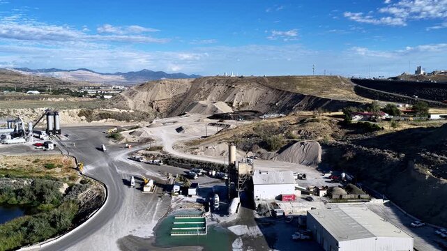 Lehi, Utah, United States - 21 August 2026: Aerial view of Staker Parson Point West aggregate pit and ready-mix concrete plant with industrial machinery and gravel mounds.