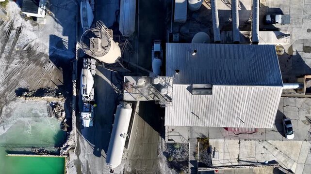 Lehi, Utah, United States - 21 August 2026: Aerial view of Staker and Parson Point West aggregate pit and ready-mix concrete plant with industrial silos and trucks.