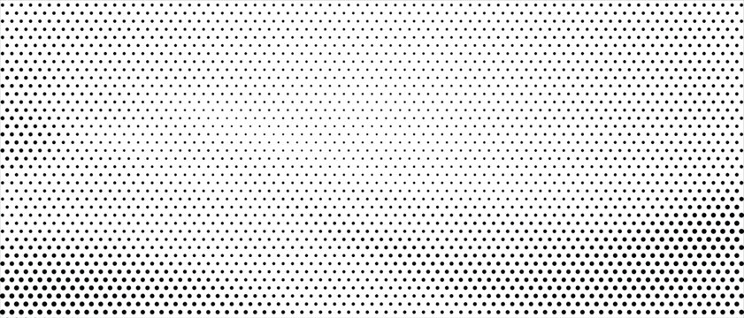 Abstract halftone dot background in black and white with fading gradient pattern texture
