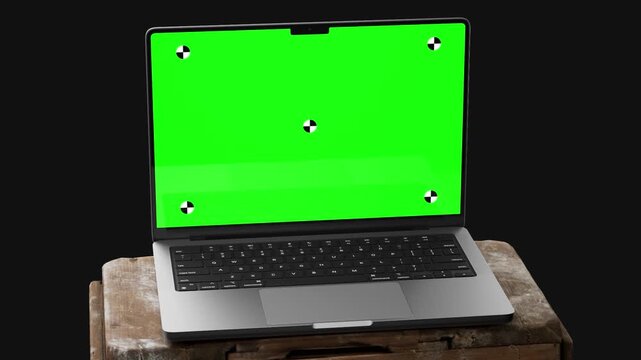 laptop green screen on rustic wooden crate