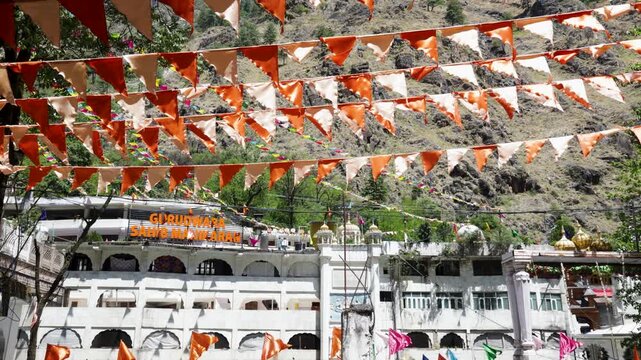 Gurudwara Sahib Manikaran Decorated with Orange and White Flags in Himachal Pradesh