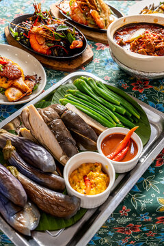 Traditional Asian Salad Ulam Platter with Diverse Food Spread