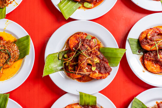 Close-up of Spicy Sambal Prawns with Petai Beans on Banana Leaf