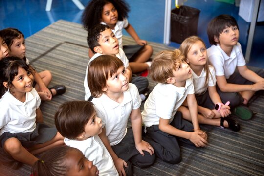 Diverse children learning together happily.